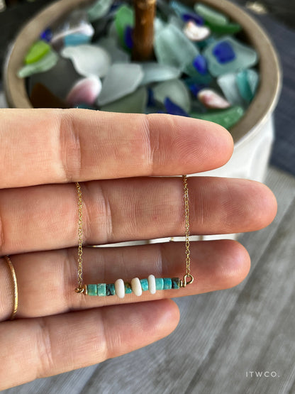 The Merchant Necklace in puka shell