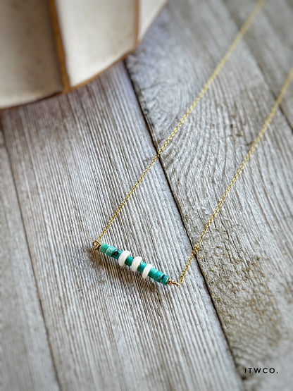 The Merchant Necklace in puka shell